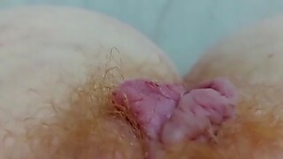 Close up video of a horny redhead ID card her hairy pussy