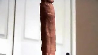 Horny slut rides a very real looking hard penis